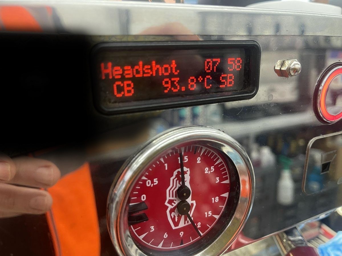 Espresso machine display and red pressure gauge
